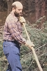 A member acquiring experience in clearing underbrush.